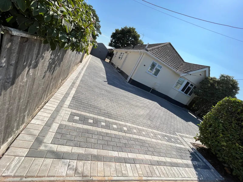 Long block-paved driveway with a contrasting patterned border